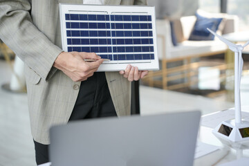 Solar panels green energy Business man working  green eco friendly office business creative idea Planing Bio economy for business eco friendly professional Engineer sustainable electricity