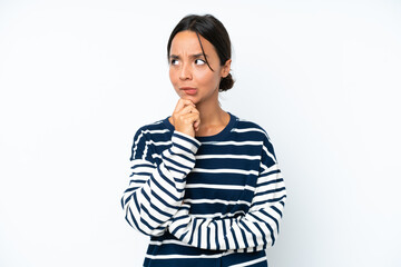 Fototapeta premium Young hispanic woman isolated on white background having doubts and thinking