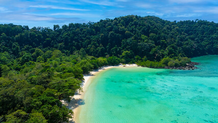 Aerial View of a Crystal Clear Beach with tropical Paradise Island