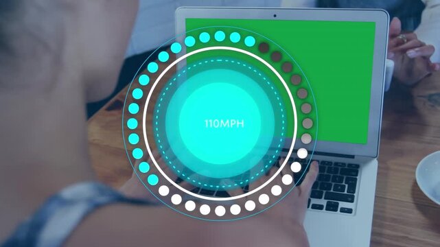 Speedometer data processing over rear view of woman using laptop with copy space at a cafe