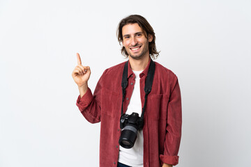 Fototapeta premium Young photographer man isolated on white background showing and lifting a finger in sign of the best