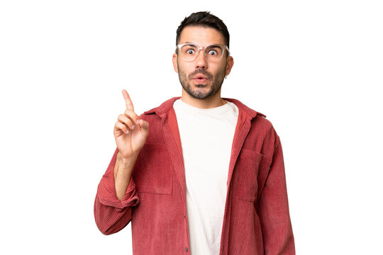 Young handsome caucasian man over isolated chroma key background intending to realizes the solution while lifting a finger up