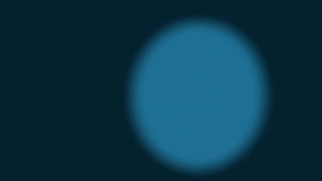 observing a circular blue shape in soft focus ambient scene