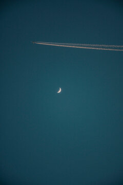 moon and airplain in the sky