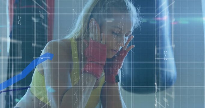 Animation of financial graph over fit caucasian woman boxing