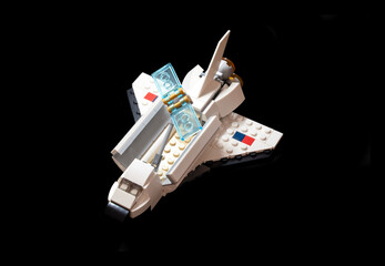 Naklejka premium MERSIN, TURKEY, JANUARY 25, 2026: Lego space shuttle toy from Creator series, isolated on black background.