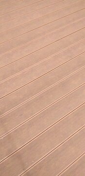 a close up of a wooden deck with brown lines.wood Background texture 