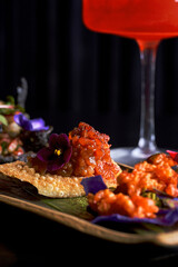 Assorted Salmon and Tuna Tartare Appetizers on Crispy Chips
