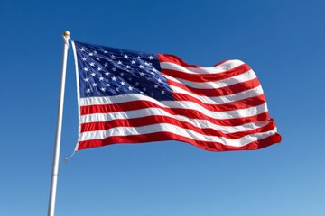 Fototapeta premium American Flag Waving Strongly in Open Sky During Bright Midday Sun