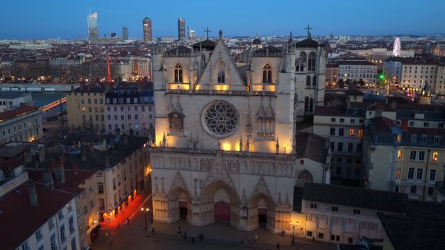 orbiting aerial shot of Lyon Cathedral at night night, night illumination of the Cathedral of Saint John the Baptist of Lyon, historic medieval cathedral in Lyon