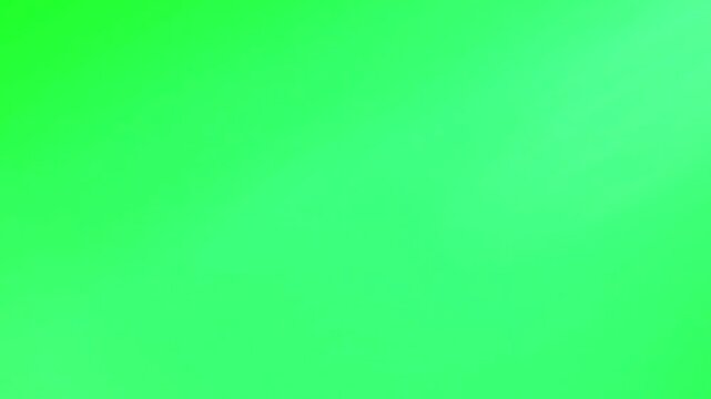 Intense white lightning strike visually cuts vertically across a vivid bright green screen background representing atmospheric electrical discharge effects.