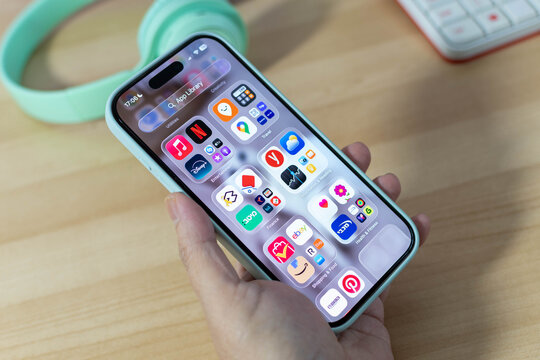 Beer Sheva, Israel. September 18, 2025: Female hand holding iPhone 16, Entertainment and Finance.