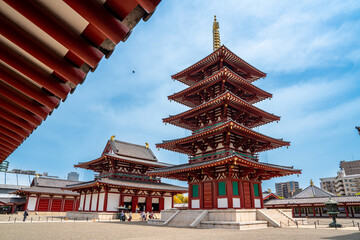Shitennō-ji Buddhist temple, Osaka, Japan. Famous buddhist temple with a five story pagoda, statues and japanese zen garden, first built in 593 d.C.