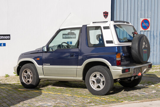 Suzuki vitara suv parked in reserved parking space