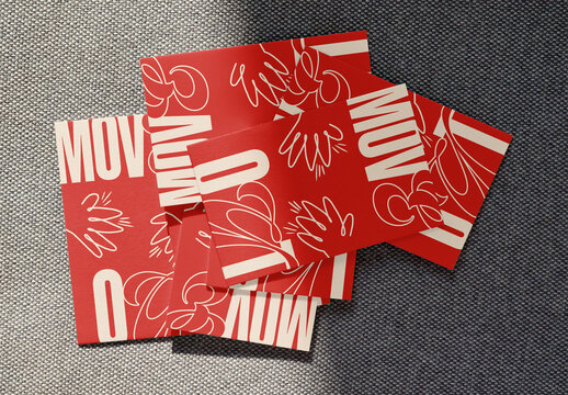 Mockup from real photo of Business Cards shown on a textured surface.