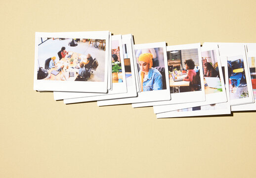 Mockup of real photo from Several blank polaroids arranged on a plain surface
