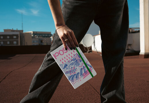 Mockup of real photo from a woman Holding a Notebook