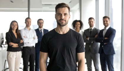 Obraz premium Man standing confidently in front of diverse business team representing leadership and corporate success