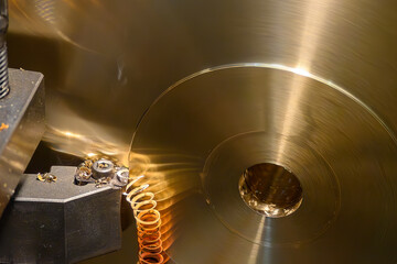 Close Up of Lathe Machine Cutting Brass Parts with Continuous Chip