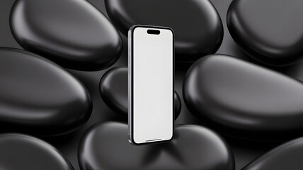 A sleek smartphone with a blank screen stands on smooth black stones