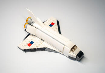 Naklejka premium MERSIN, TURKEY, JANUARY 25, 2026: Lego space shuttle toy from Creator series, isolated on gray background.