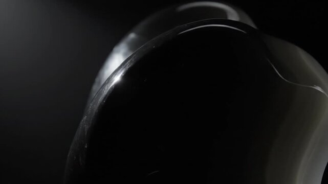 Glossy Onyx Object Under Dramatic Spotlight