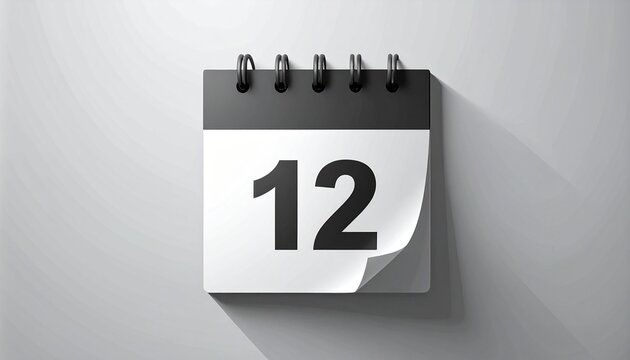 A calendar page with the number twelve on a white wall viewed straight on