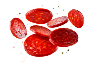 Spanish chorizo sausage slices in the air, cut out