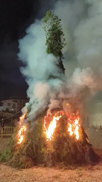 Bonfire celebration in honor of Saint Anthony the Abbot in J&aacute;vea, Spain, made from wood and pine branches. Pagan and Christian festival.