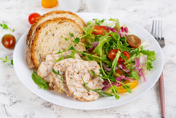 Chicken meatloaf and fresh salad and toasts. Healthy lunch or dinner.