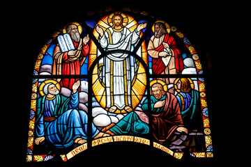 Vibrant Stained Glass Window Depicting the Transfiguration of Jesus Christ with Moses and Elijah