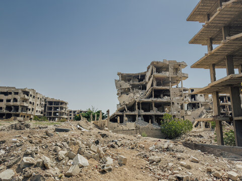 Urban ruins in Jobar, Damascus, with rubble and collapsed houses caused by the conflict in Syria.