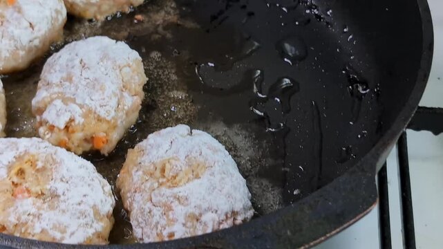 Cooking fish patties in a kitchen with hot oil and simple steps for a tasty meal