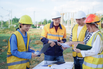 Male and female engineers who are Asian professionals in the construction industry focus on village design and architecture to create sustainable houses for people to rent and sell.