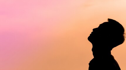 Naklejka premium backlight. Male silhouette against a vibrant sunrise sky with dramatic backlighting. travel magazines, destination branding, designed for travel destination branding, used by devops engineers. 