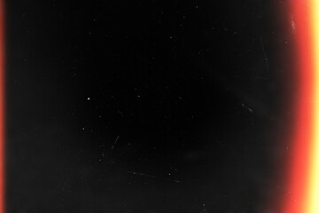 light leaks overlay effect with dust and blurred orange light.retro film Cinematic flare light leak on a black background.abstract analog film burn ray light.Leaked camera poster photo effect mockup © PT-studio
