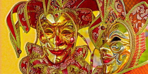 Fototapeta premium splendid colorful masks of yellow and red have fun at Carnival