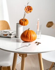 Autumnal Still Life - Pumpkins, Candle, and Spices on a White Table.