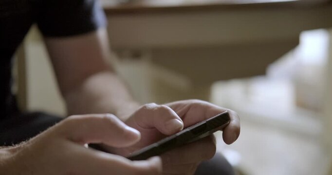 Man playing mobile phone close-up. High quality 4k footage