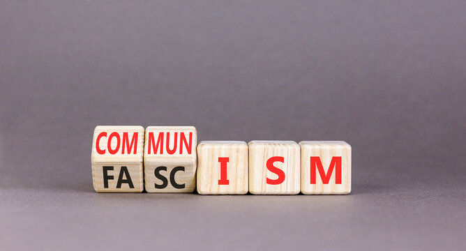 Communism or fascism symbol. Concept words Fascism to Communism on beautiful wooden cubes. Beautiful grey table grey background. Business historical and communism or fascism concept. Copy space.