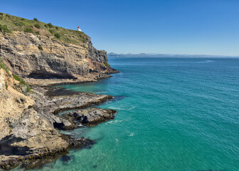 Fototapeta premium Taiaroa Head Lighthouse Reserve under bright blue skies, home of the Royal Albatross, New Zealand