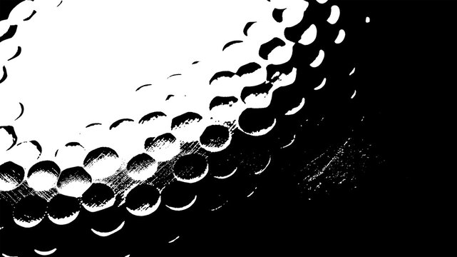 Close-up of a golf ball's dimpled surface in black and white, abstract sports or technology texture