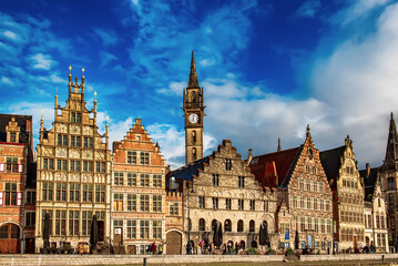 Obraz premium Ghent city historical center, tourists boats and colorful buildings on Leie river bank, Belgium