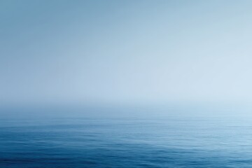 Obraz premium Minimalist foggy blue sea and sky, soft gradient tones, calm atmosphere, copy space