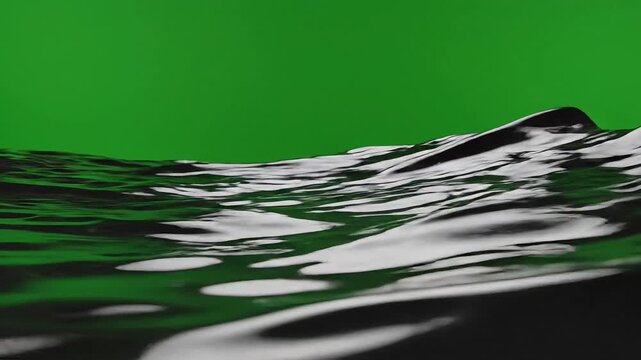 Isolated chocolate melting in a slow motion wave pattern on a green screen background