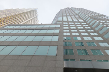 Naklejka premium oblique skyward view of TD Canada Trust Tower, a business center, located at 161 Bay St, Toronto (shown here on Front St W) and Royal Bank Plaza (left)