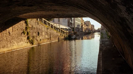 Fotobehang Milaan old bridge over the river in the city of Milan  © Stemoir