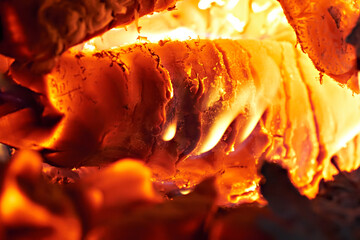 Close-up of smoldering wood after burning. Firewood burning in a rural stove.