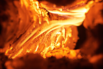 Close-up of smoldering wood after burning. Firewood burning in a rural stove.