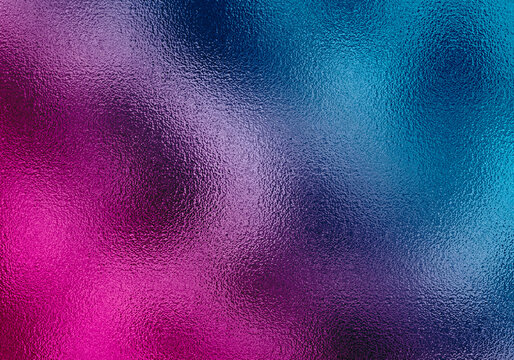 Iridescent multi color metallic foil texture featuring pink purple and blue gradients for creative holographic style backgrounds